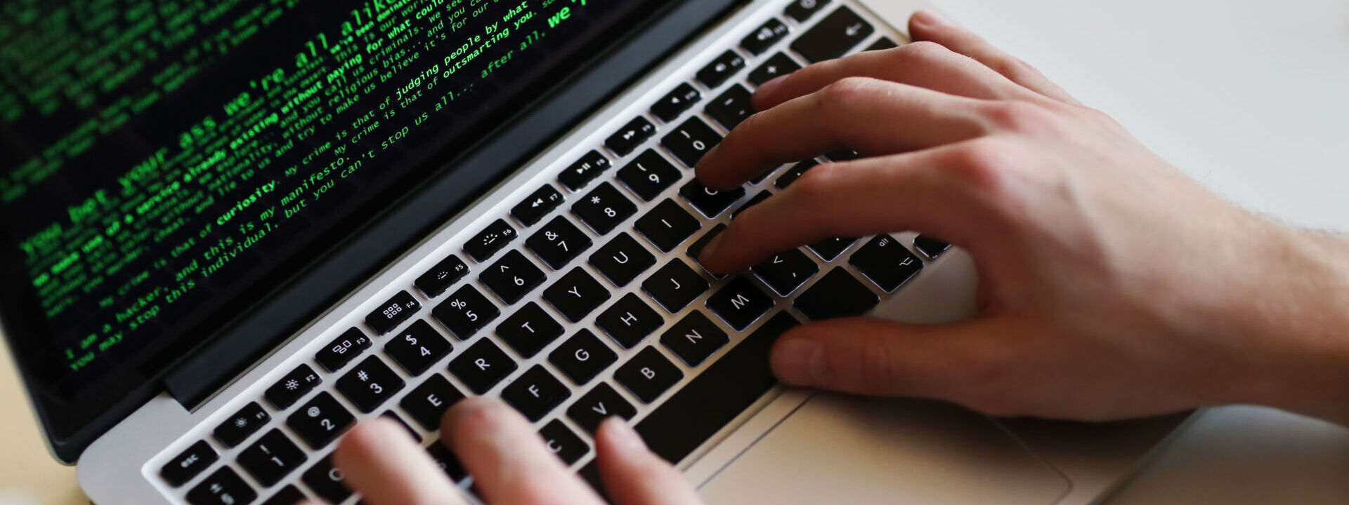 hacker man on laptop scaled e1620416438709